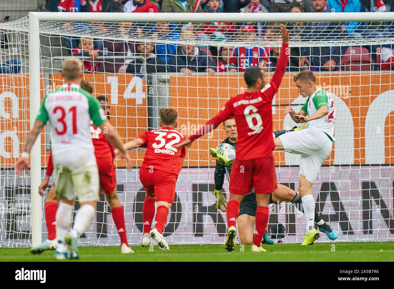 Football FC Augsburg - FC Bayern München, Augsburg October 19, 2019. Alfred FINNBOGASON, FCA 27 shoot on goal, pull off, shot, free kick,Manuel NEUER, FCB 1  FC AUGSBURG - FC BAYERN MUNICH  - DFL REGULATIONS PROHIBIT ANY USE OF PHOTOGRAPHS as IMAGE SEQUENCES and/or QUASI-VIDEO -  1.German Soccer League , Augsburg, October 19, 2019  Season 2019/2020, matchday 08, FCA, FCB,  © Peter Schatz / Alamy Live News Stock Photo
