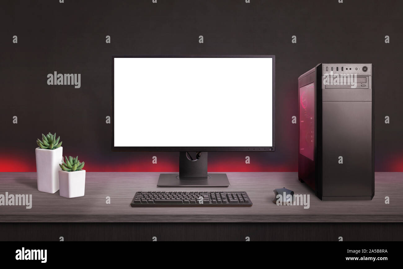 Gaming computer display isolated for mockup, game presentation. Red light on computer case and desk. PC gaming concept. Stock Photo