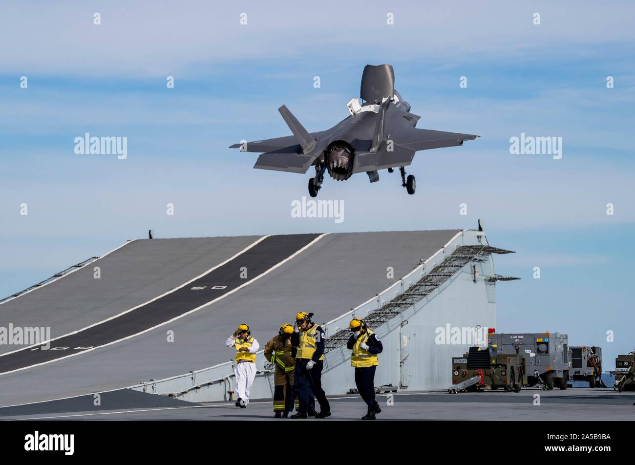A Royal Air Force F-35B Lightning stealth fighter aircraft launches from the flight deck of the HMS Queen Elizabeth during flight operations October 17, 2019 in the Atlantic Ocean. HMS Queen Elizabeth, is the largest warship ever built by the Royal Navy and is currently deployed in support of exercise WESTLANT 19. Stock Photo