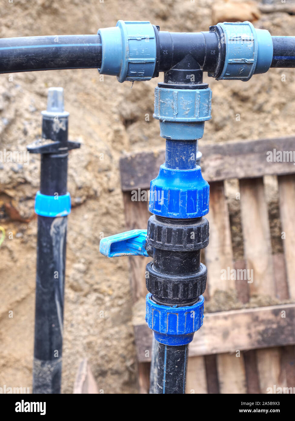 Three way joint of the PVC pipe. Potable water delivery system under