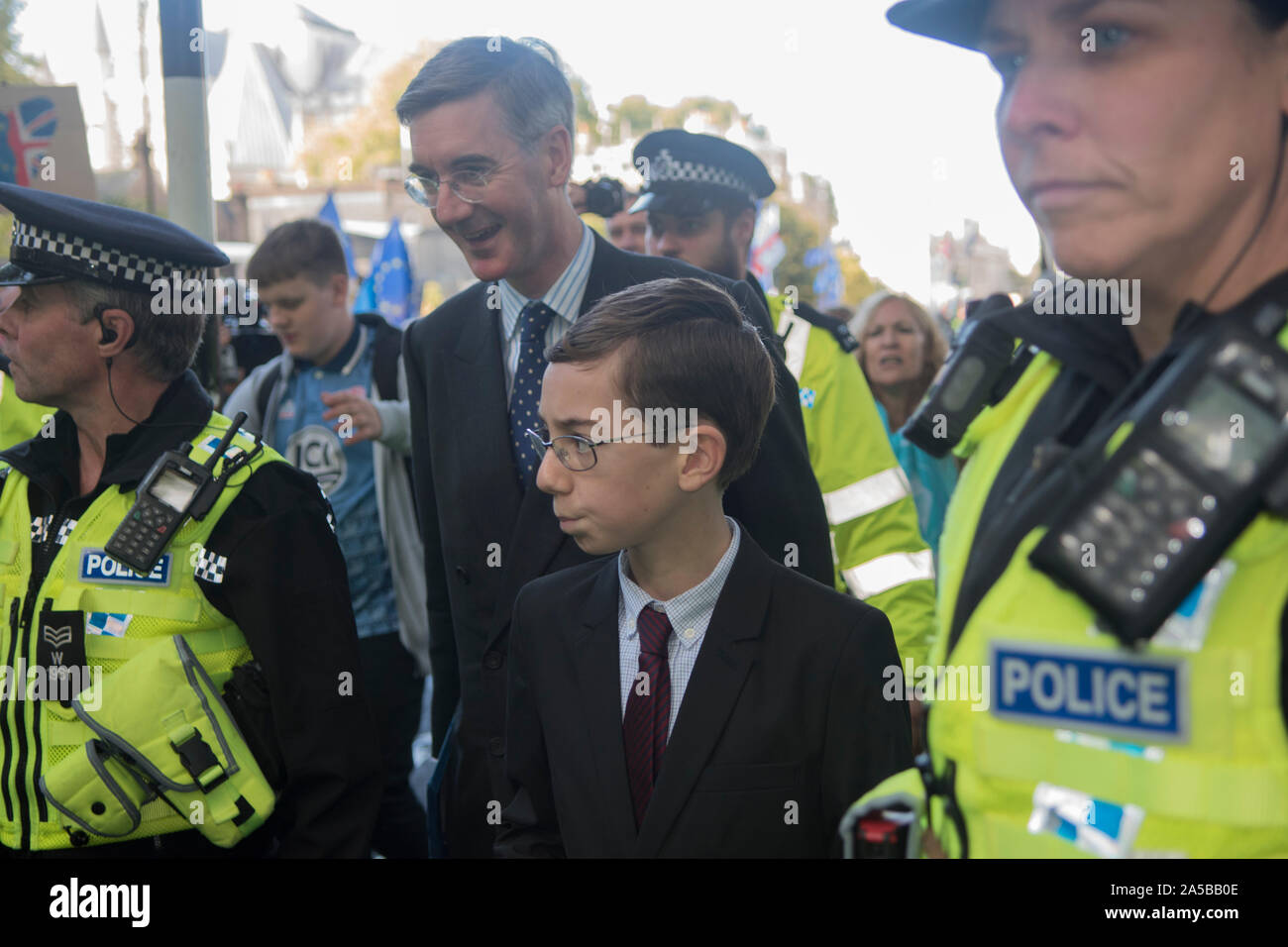 Peter Rees-Mogg son of Jacob Rees-Mogg MP need police protection when they leave the House of Commons after the Brexit debate on Super Saturday 19th October 2019. They are flanked by a group of police while protesters shout verbal  abuse and threaten them. London England UK  2010s  HOMER SYKES Stock Photo