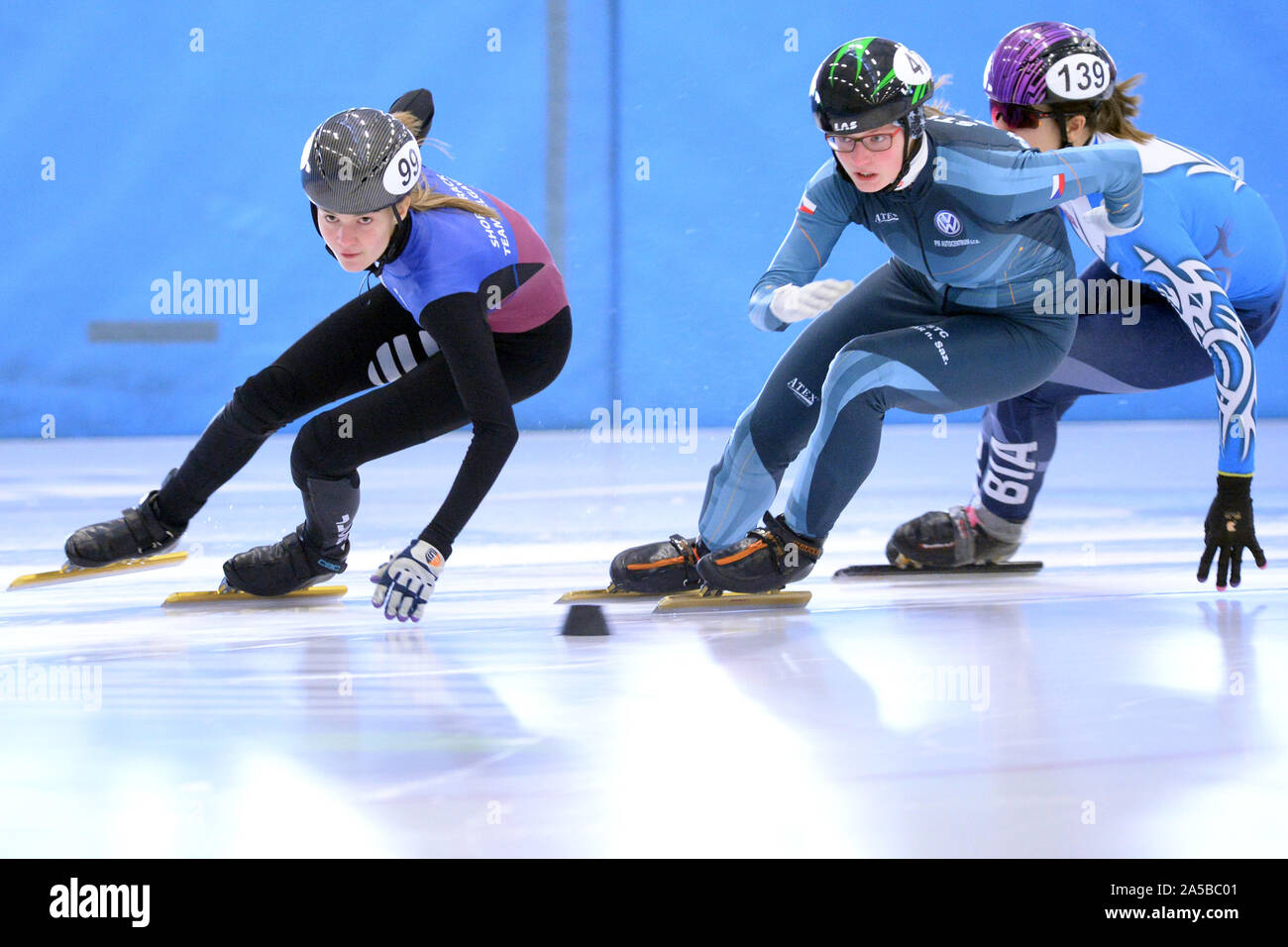 Benatky Nad Jizerou, Czech Republic. 19th Oct, 2019. Speed skaters JANKOVSKA Laura of Latvia (99), KUDLACKOVA Kristyna of Czech Republic (47) and BOBIER Oliwia of Poland (139) competes during the ISU Danubia Series 1 at Czech Open in Benatky nad Jizerou (30 kilometers north of Prague) in the Czech republic, October 19, 2019.Short track speed skating starting to play sports by children and adults in the Czech Republic. Short track speed skating is a form of competitive ice speed skating. In competitions, multiple skatersskate on an oval ice track with a circumference of 111.12 m. Credit: ZUMA P Stock Photo
