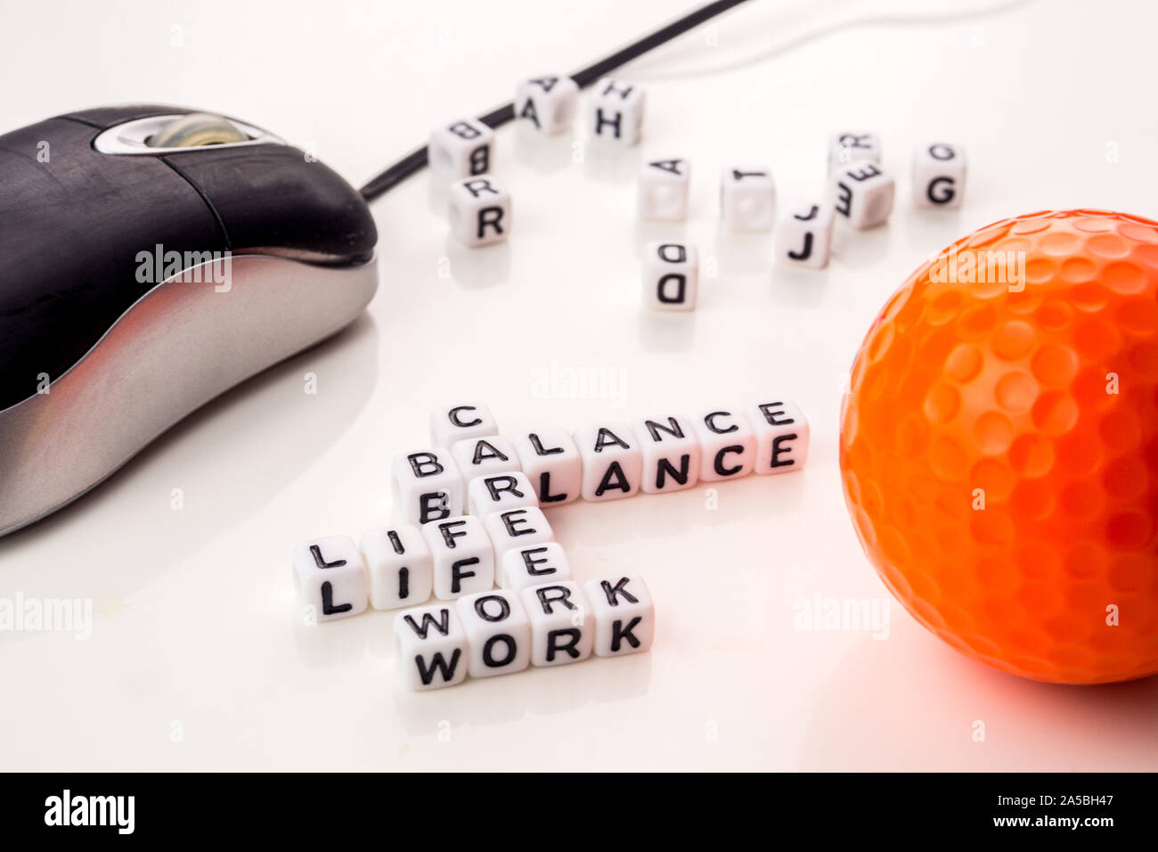little white dices with black letters forming a crossword with the ...