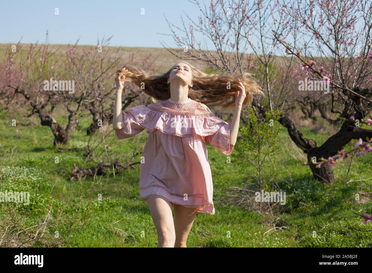 Woman in gorgeous dress walks hi-res stock photography and images - Alamy
