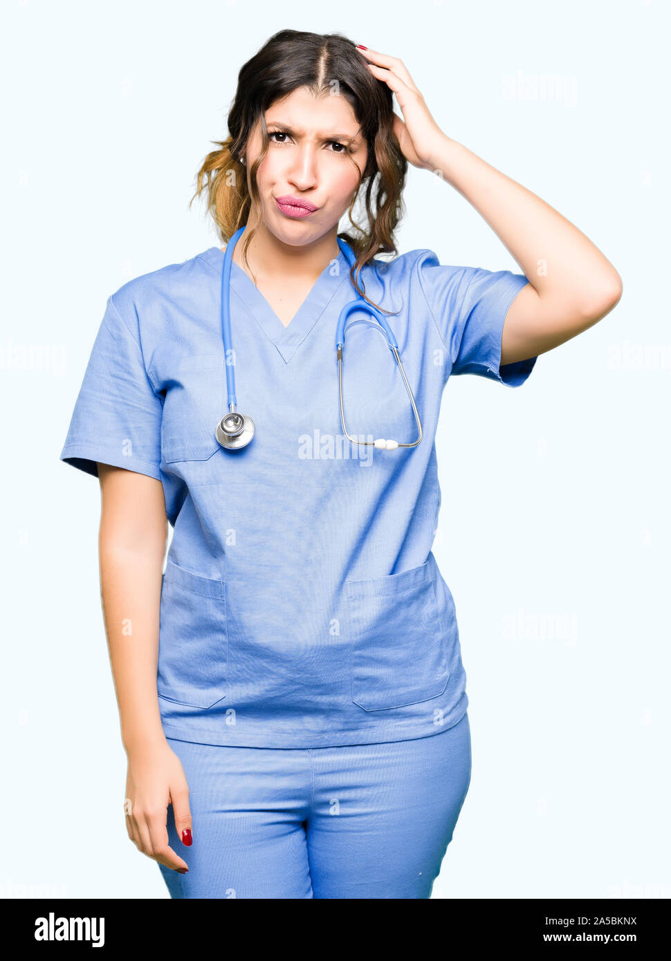 Young adult doctor woman wearing medical uniform confuse and wonder ...