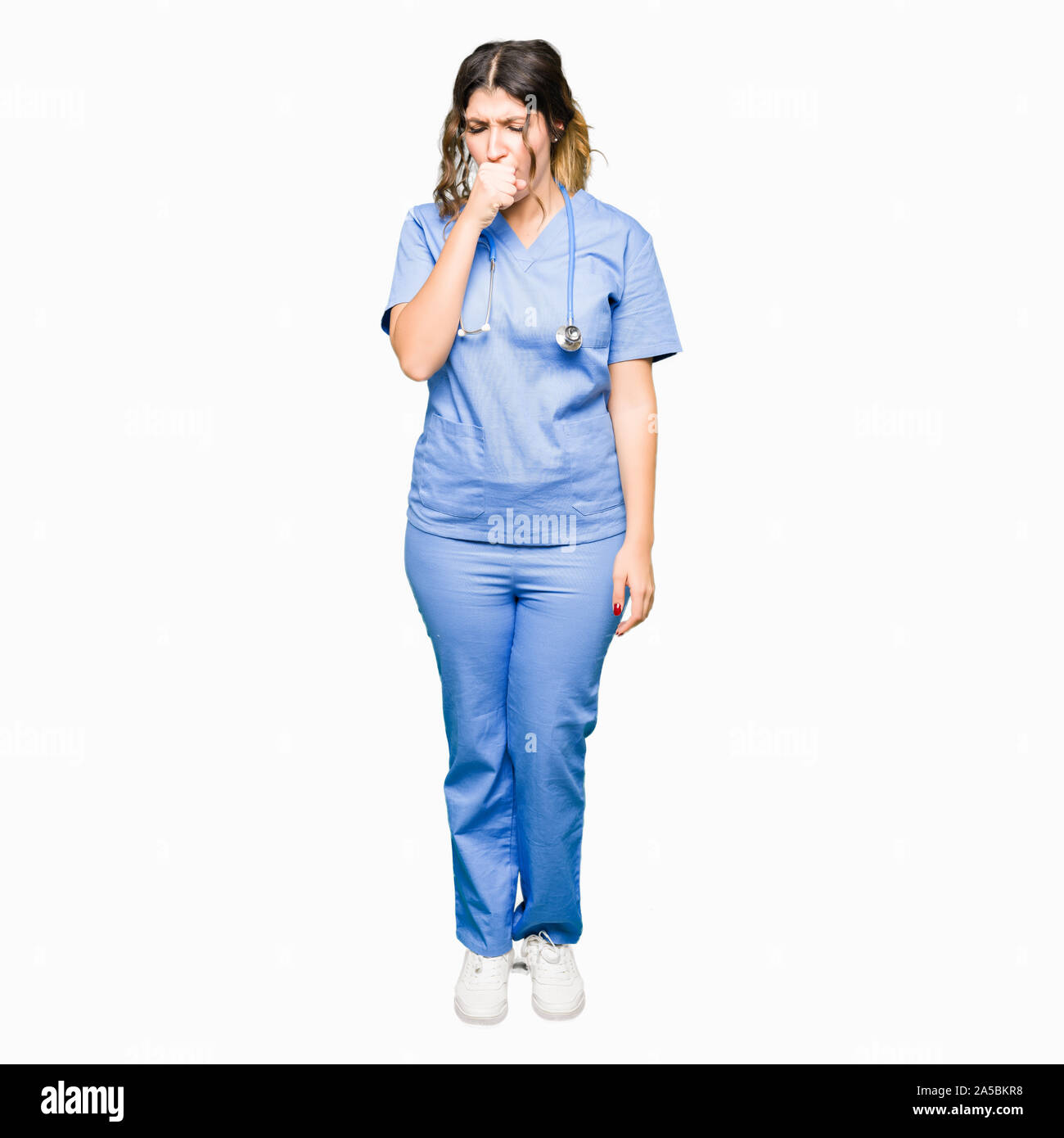 Young adult doctor woman wearing medical uniform feeling unwell and coughing as symptom for cold