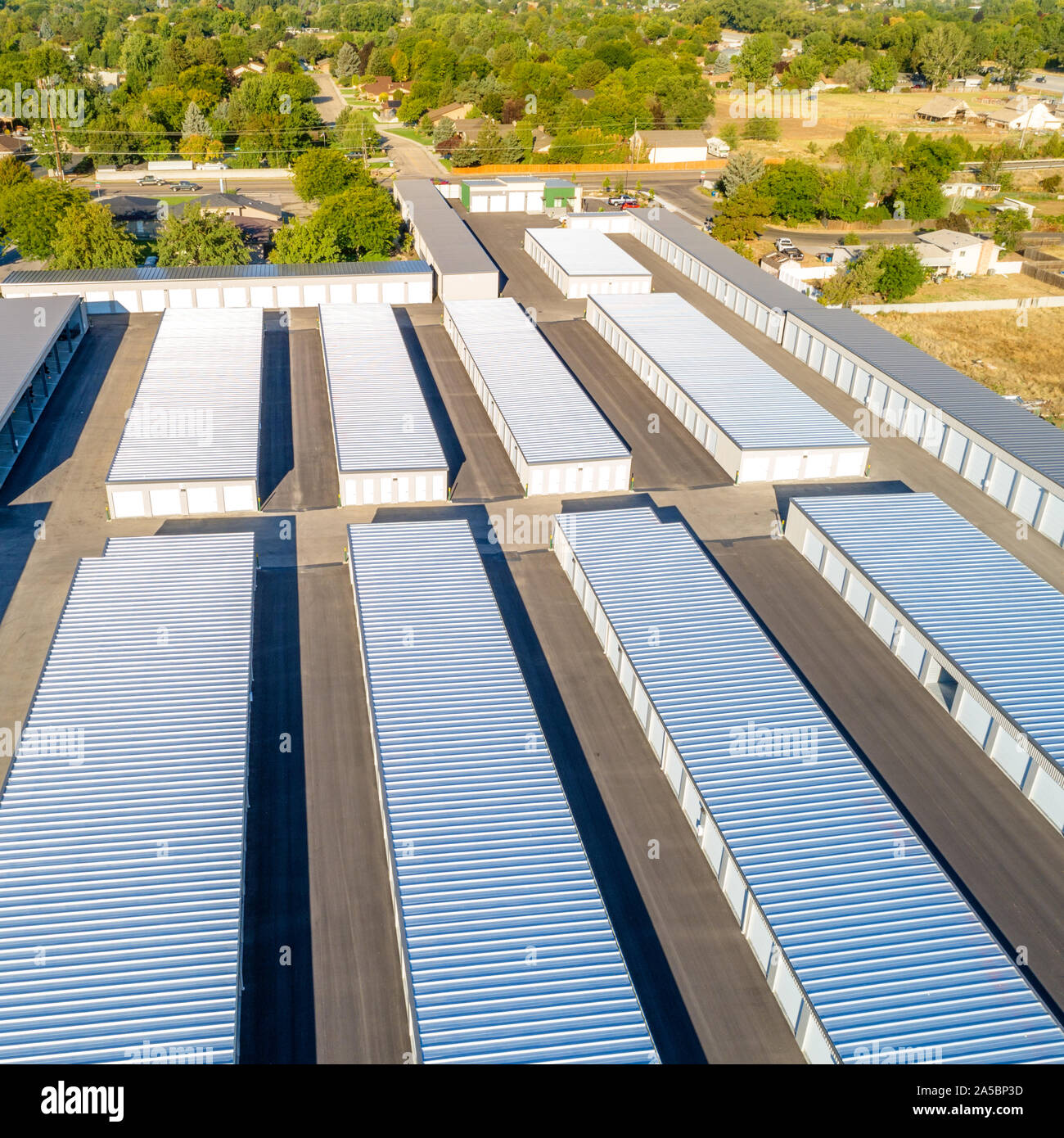 Aerial view of a storage unit complex with many trees Stock Photo - Alamy