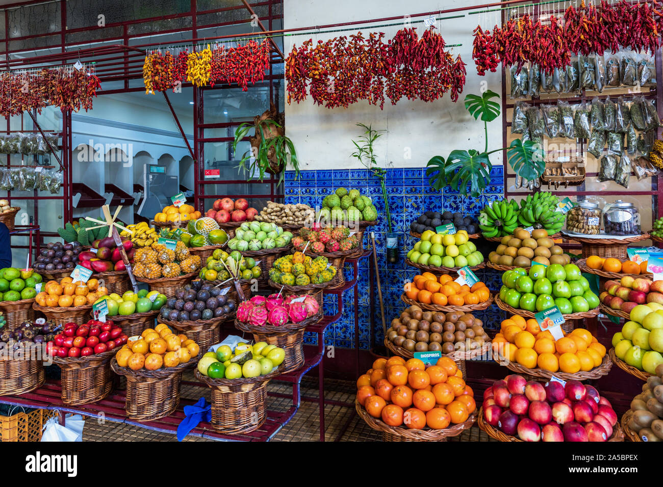 A colourful, neat and tidy display of fruit on this stall in Mercado dos Lavradores, Funchal, Madeira, Portugal Stock Photo