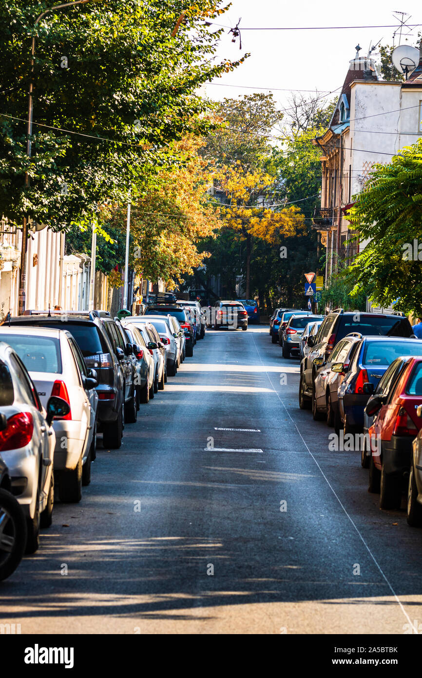 Cars parked on both sides of the road hi-res stock photography and ...