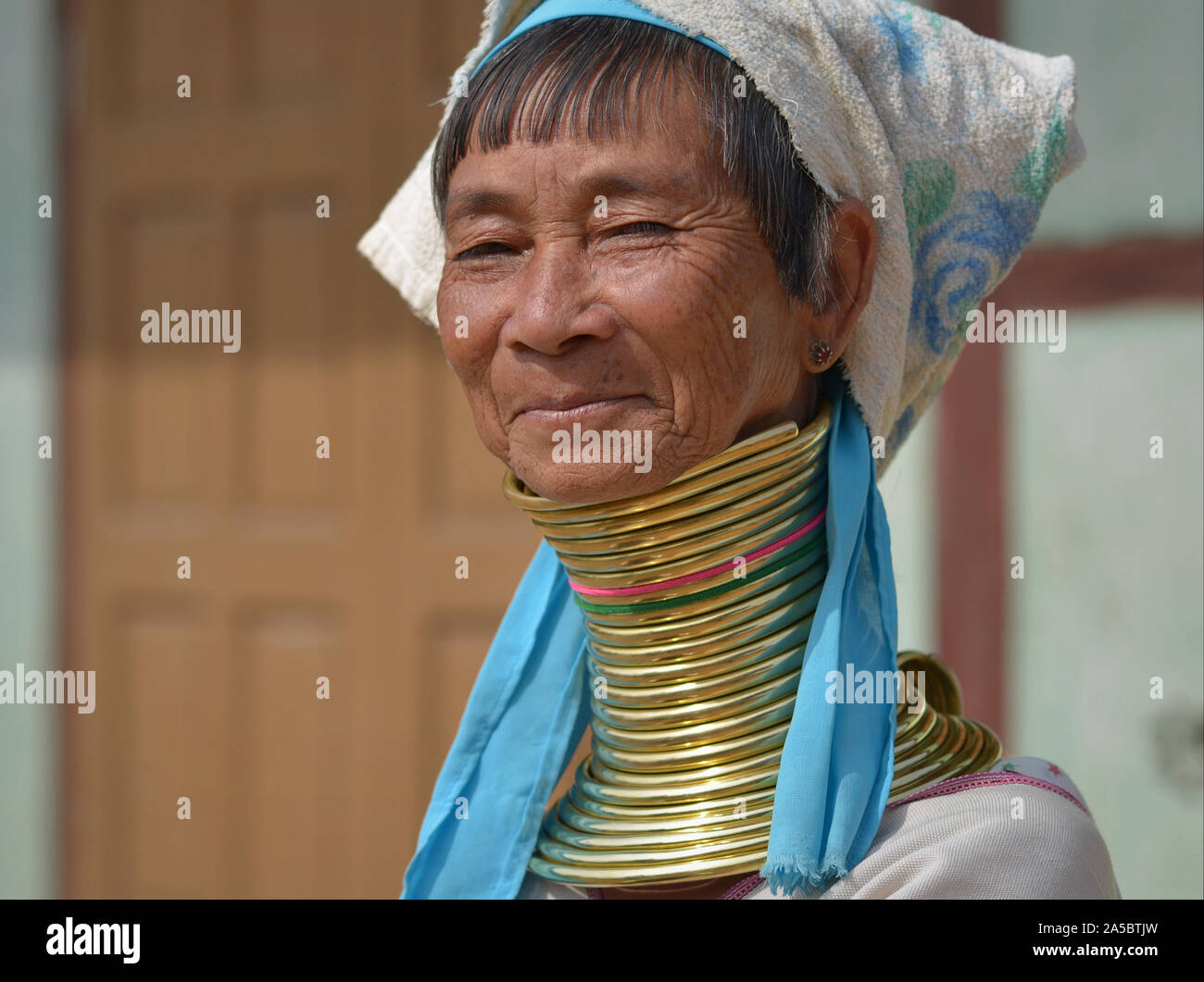 Elderly Myanmarese Kayan Lahwi longneck woman (“giraffe woman”) with 22