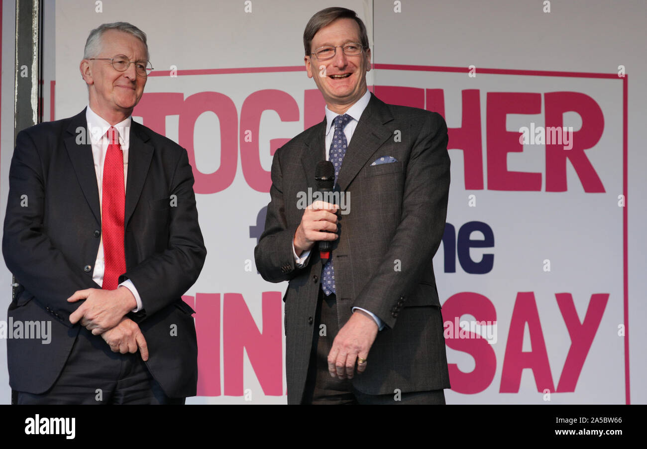 London, UK, 19 Oct 2019.Hilary Benn, Labour (left), who brought the Benn Act to Parliament, and Dominic Grieve, Conservative (right), QC. Politicians take to the main stage on Parliament Square where thousands have assembled as part of the People's Vote March. The stage is outside the Houses of Parliament where MPs were discussing Brexit. Credit: Imageplotter/Alamy Live News Stock Photo