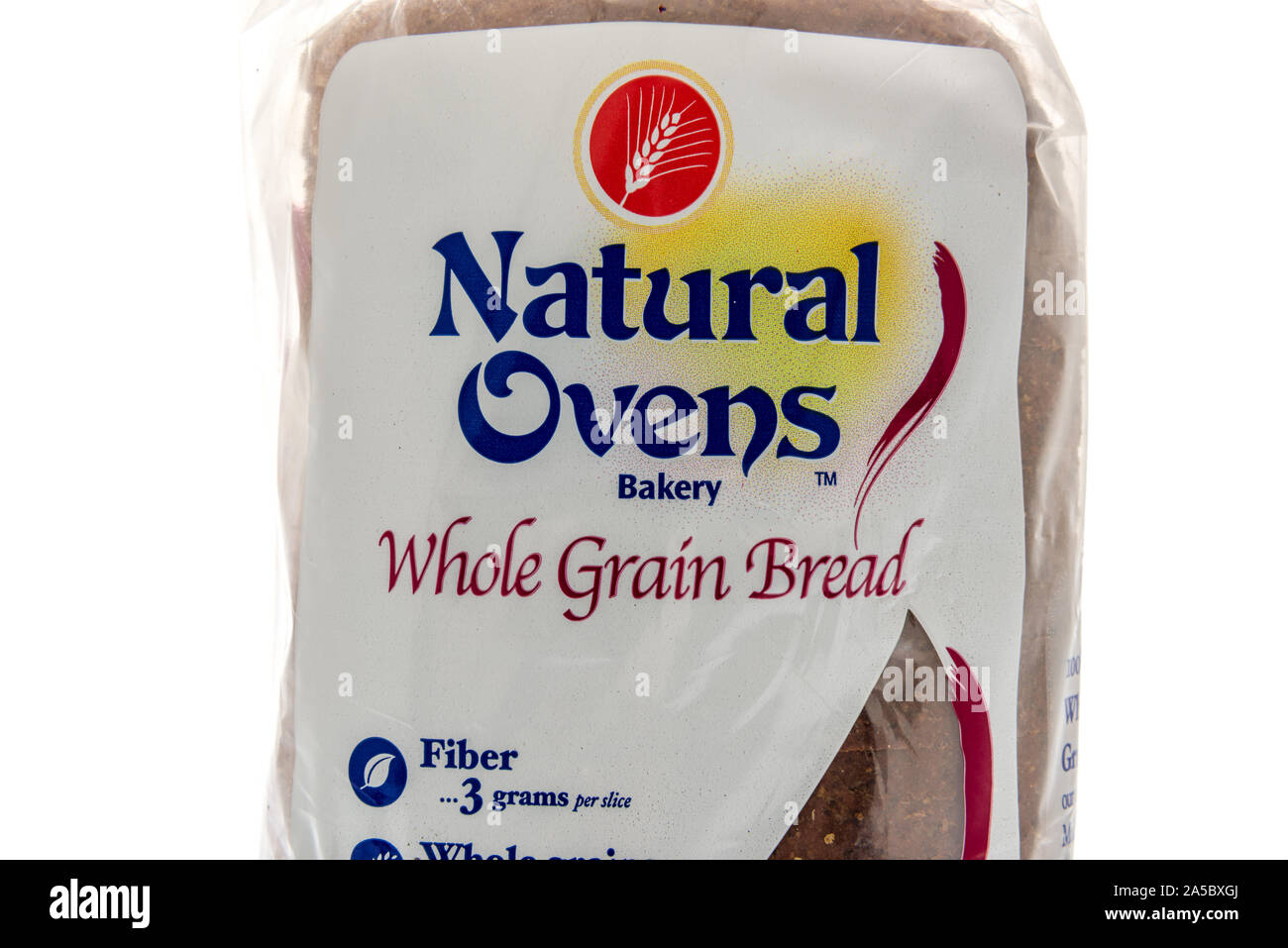 Winneconne, WI - 22 September 2019: A package of Natural Ovens bakery whole grain bread loaf on an isolated background. Stock Photo