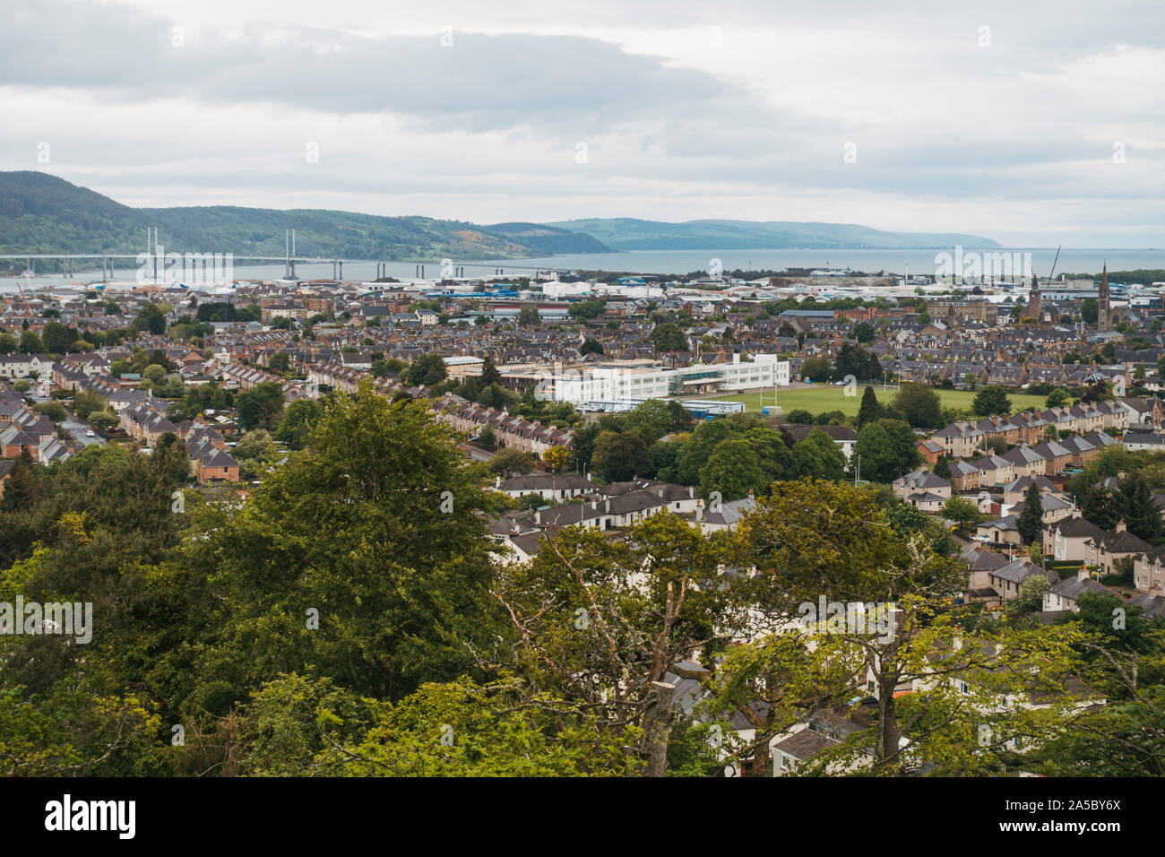 Looking out over the city of Inverness on a cloudy day from on top of Tomnahurich Cemetery Hill Stock Photo