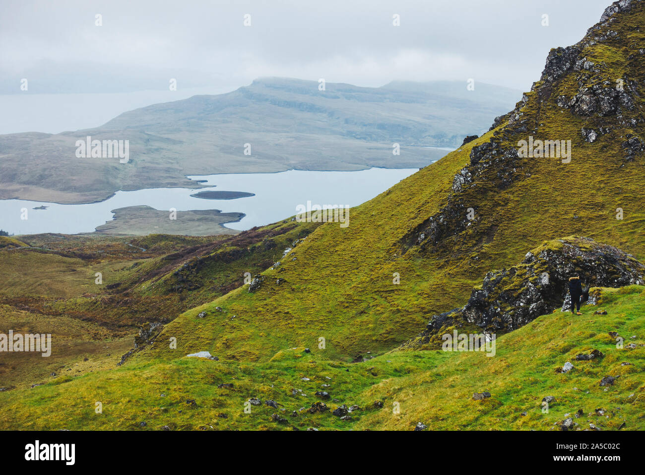 A grey, rainy, cloudy day at the Old Man of Storr, a famous rock formation on the Isle of Skye, Scotland Stock Photo