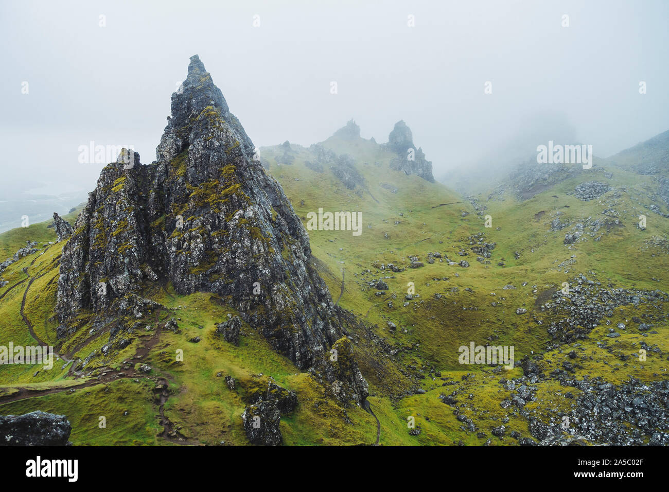 A grey, rainy, cloudy day at the Old Man of Storr, a famous rock formation on the Isle of Skye, Scotland Stock Photo
