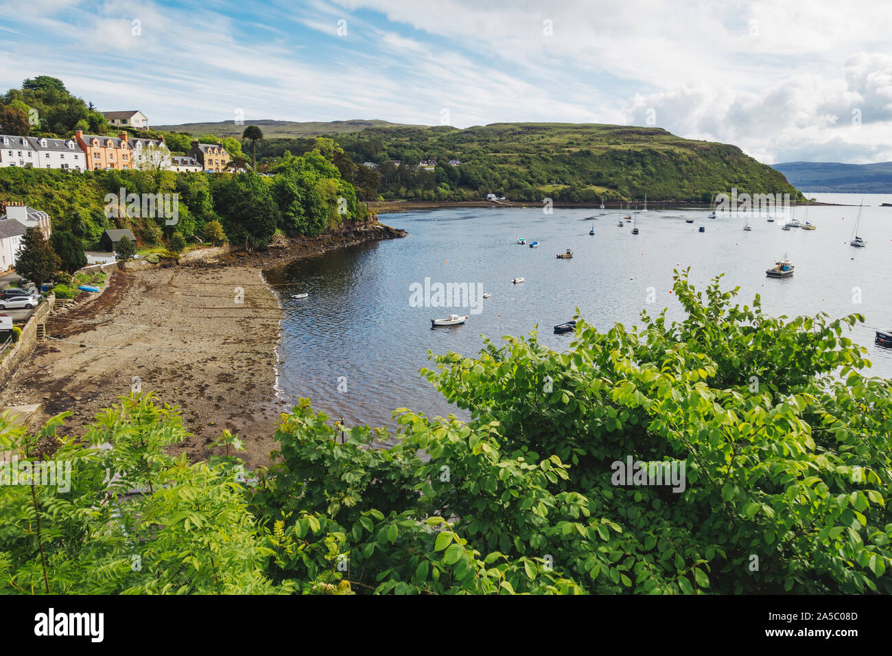 Boats moored in Portree Harbour, as seen from up on The Lump, a hill on the edge of Portree township, Scotland, UK Stock Photo
