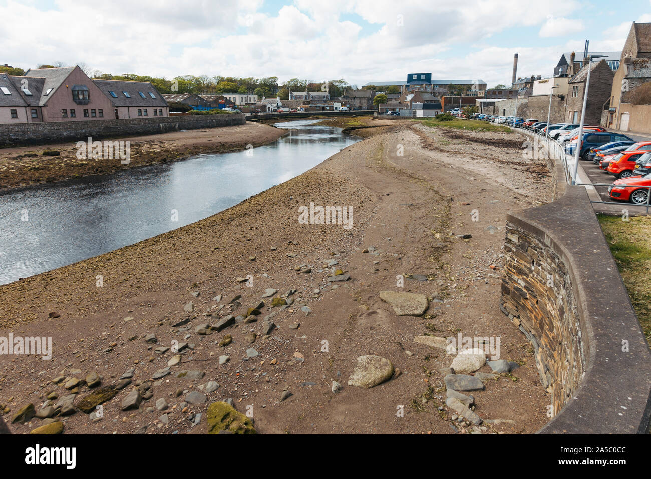 The banks of the Wick River as it runs through the town of Wick in the north of the United Kingdom Stock Photo