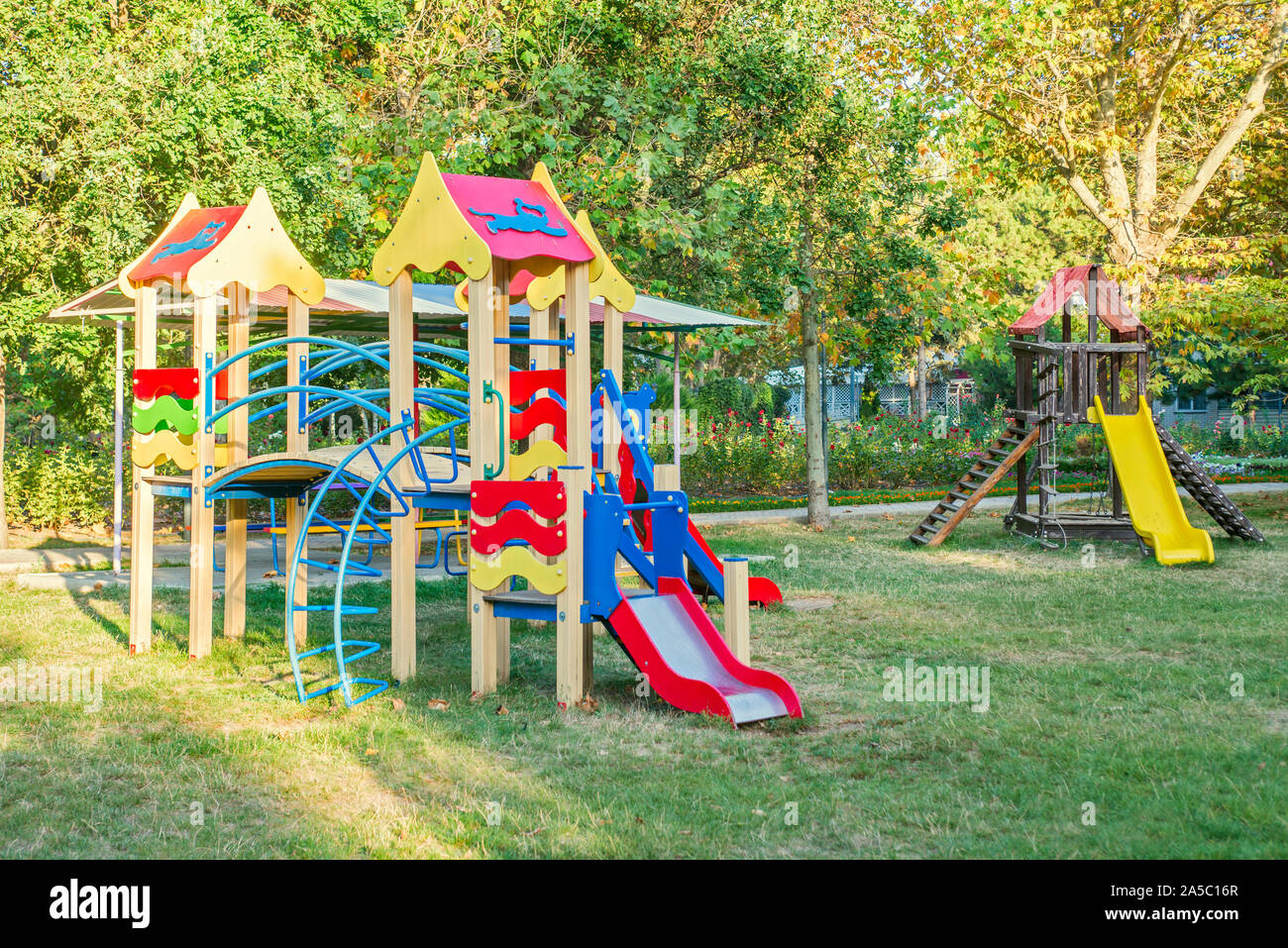 Colorful children playground activities in public park. Safe modern children's playground. Stock Photo