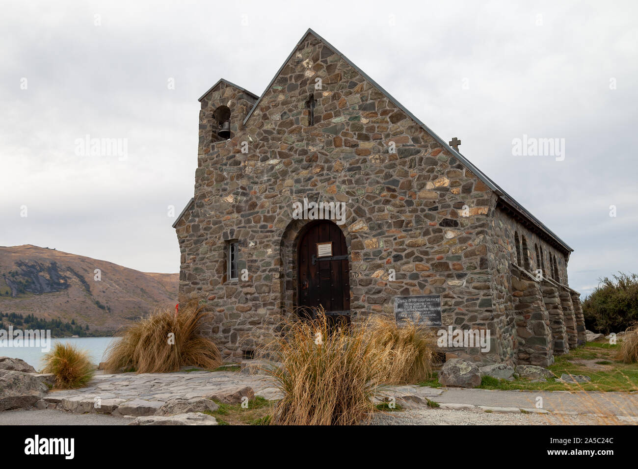The Church of the Good Shepherd is a well known tourist attraction on the southern end of lake Tekapo. The Church sits at the shore of the lake. Stock Photo