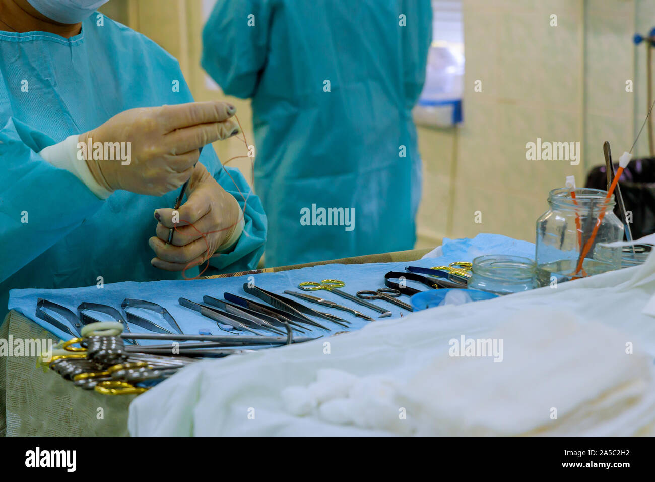 Medical sterilized surgical instruments tools on the blue table surgery