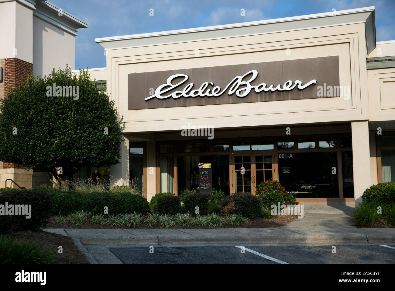 A logo sign outside of a Eddie Bauer retail store location in
