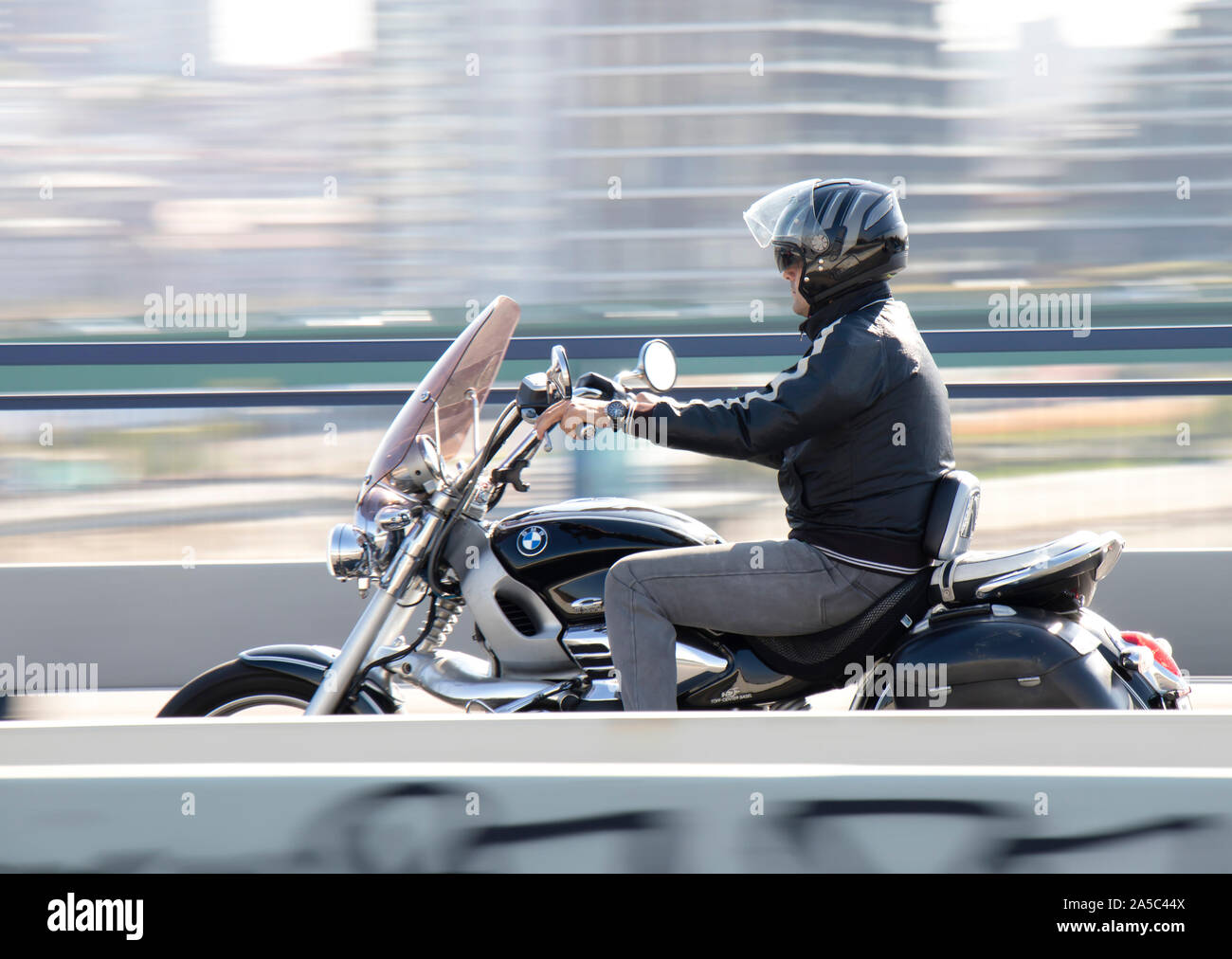 Belgrade, Serbia - October 16, 2019: One mature  man riding fast motorbike over the city street bridge Stock Photo