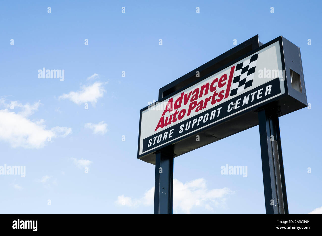 A logo sign outside of the headquarters of Advance Auto Parts in