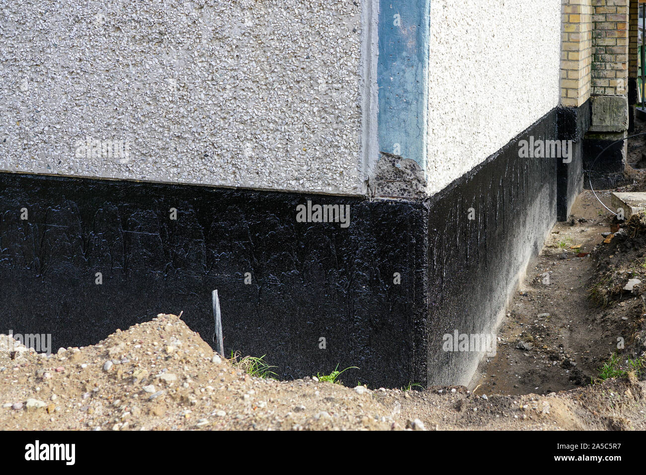 house foundation waterproofing and damp proofing with bitumen membrane Stock Photo