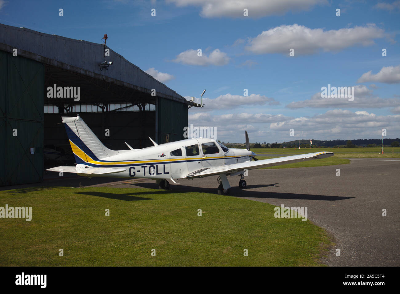 Light aircraft parked near hanger. Wolverhampton Halfpenny Green Airport. South Staffordshire. UK Stock Photo