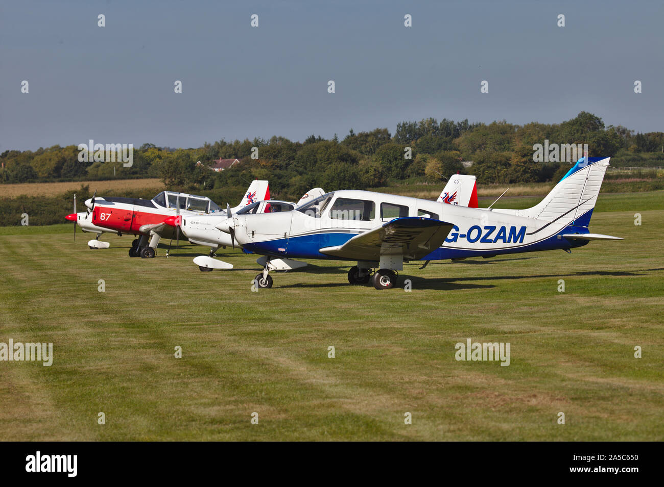 Light aircraft parked on grass. Wolverhampton Halfpenny Green Airport. South Staffordshire. UK Stock Photo