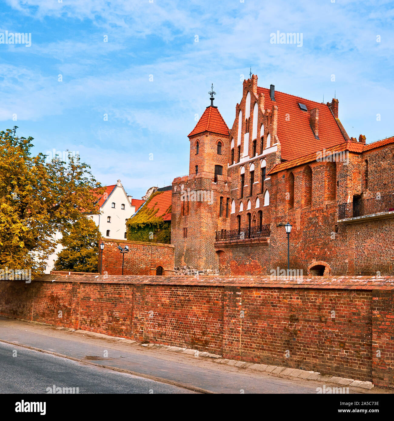Ancient city wall and medieval brick buildings of Torun old town, UNESCO world heritage site, on a bright day in Autumn Stock Photo