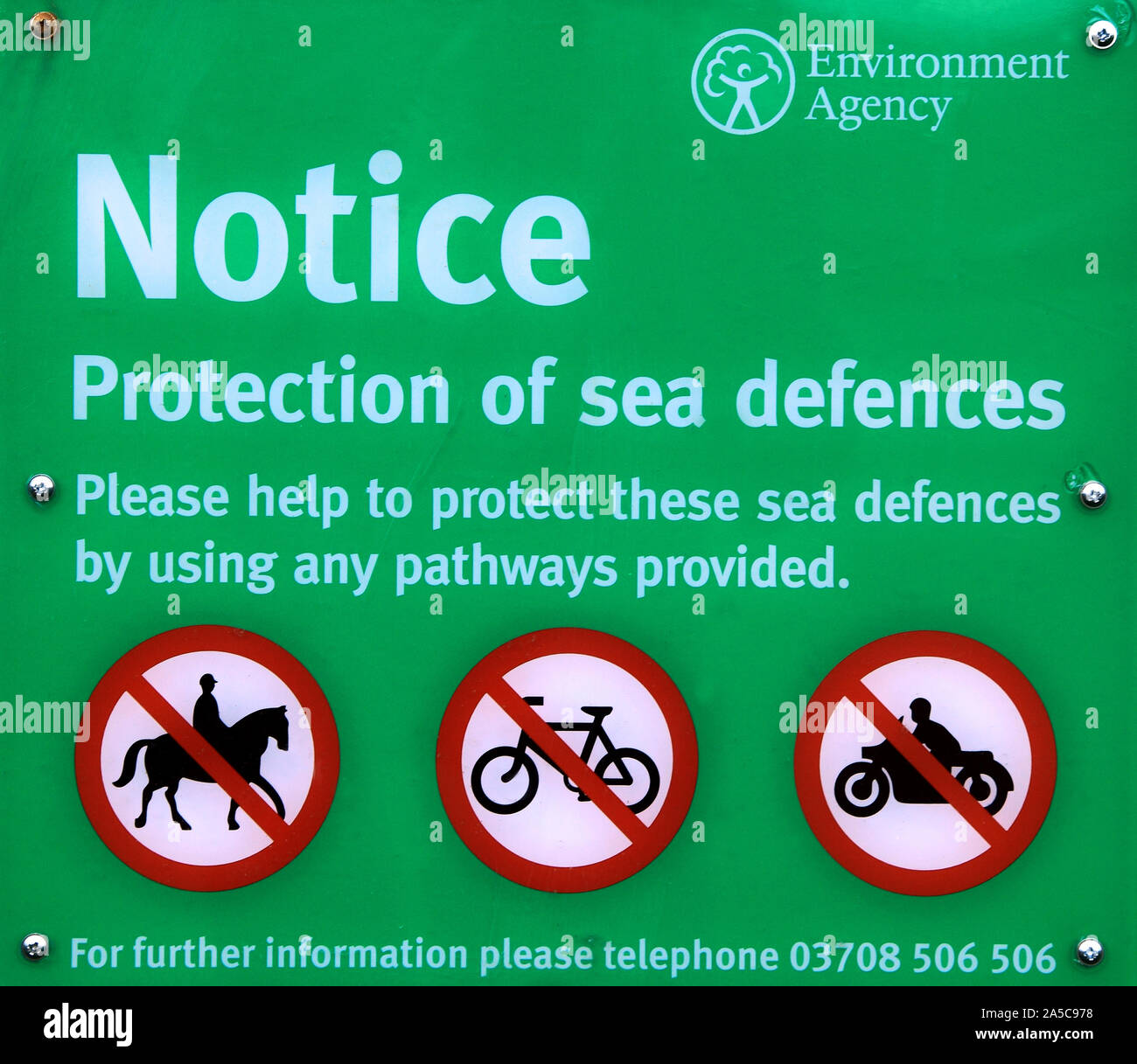 Environment Agency, notice, warning, Sea Defences, protection, sign, North Sea Coast, Thornham, Norfolk, England, UK, coastal Stock Photo