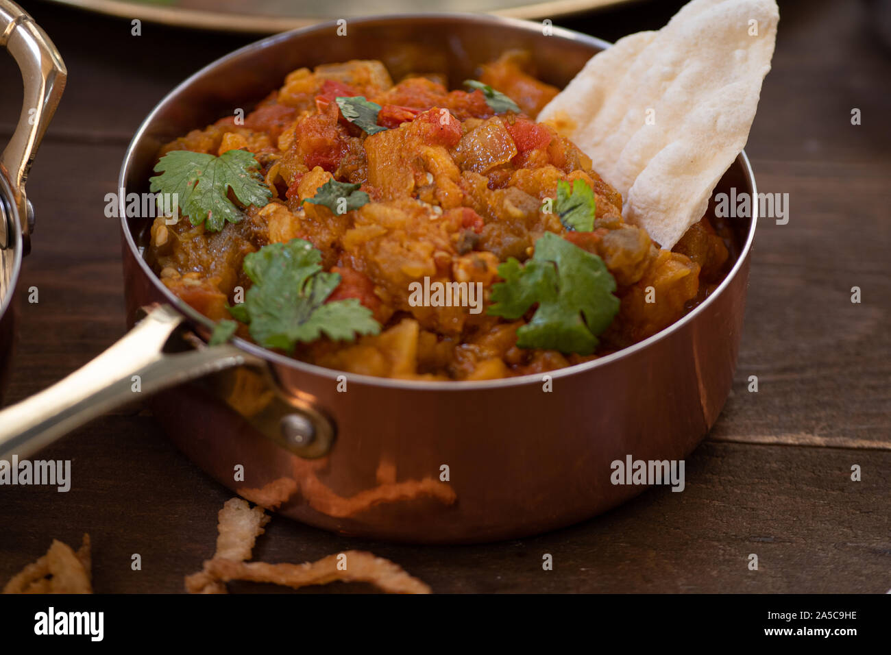 Indian baingan bharta spicy eggplant, onion and tomatoes Stock Photo