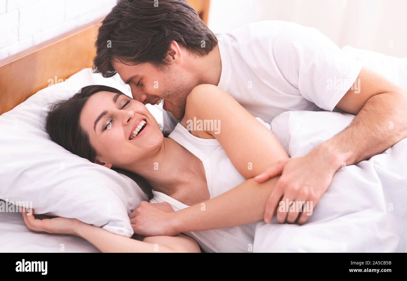 Couple Bed Bedroom Kiss Love Romance Hugging Stock Photos