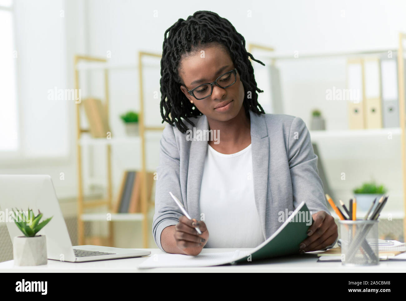 Afro Business Lady Taking Notes Working In Modern Office Stock Photo ...