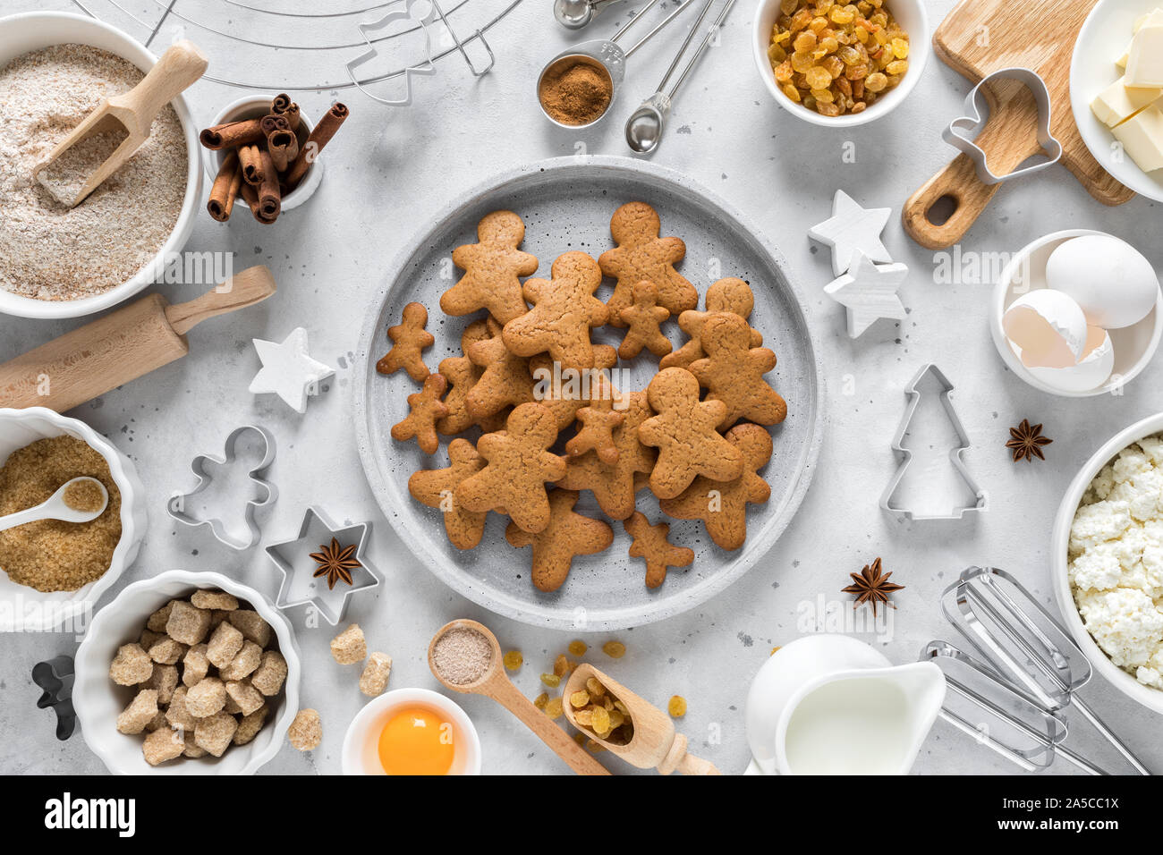 Christmas or X-mas baking culinary background, cooking recipe. Xmas gingerbread on kitchen table and ingredients for cooking festive cookies. New Year Stock Photo