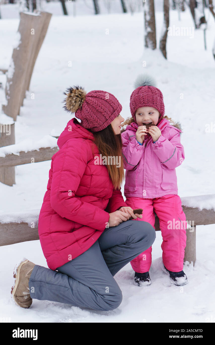 family winter activities on Mom And Daughter At Playground In Winter Relaxation Snack Restore Strength For Outdoor Activities Happiness To Be A Parent Family Look Stock Photo Alamy