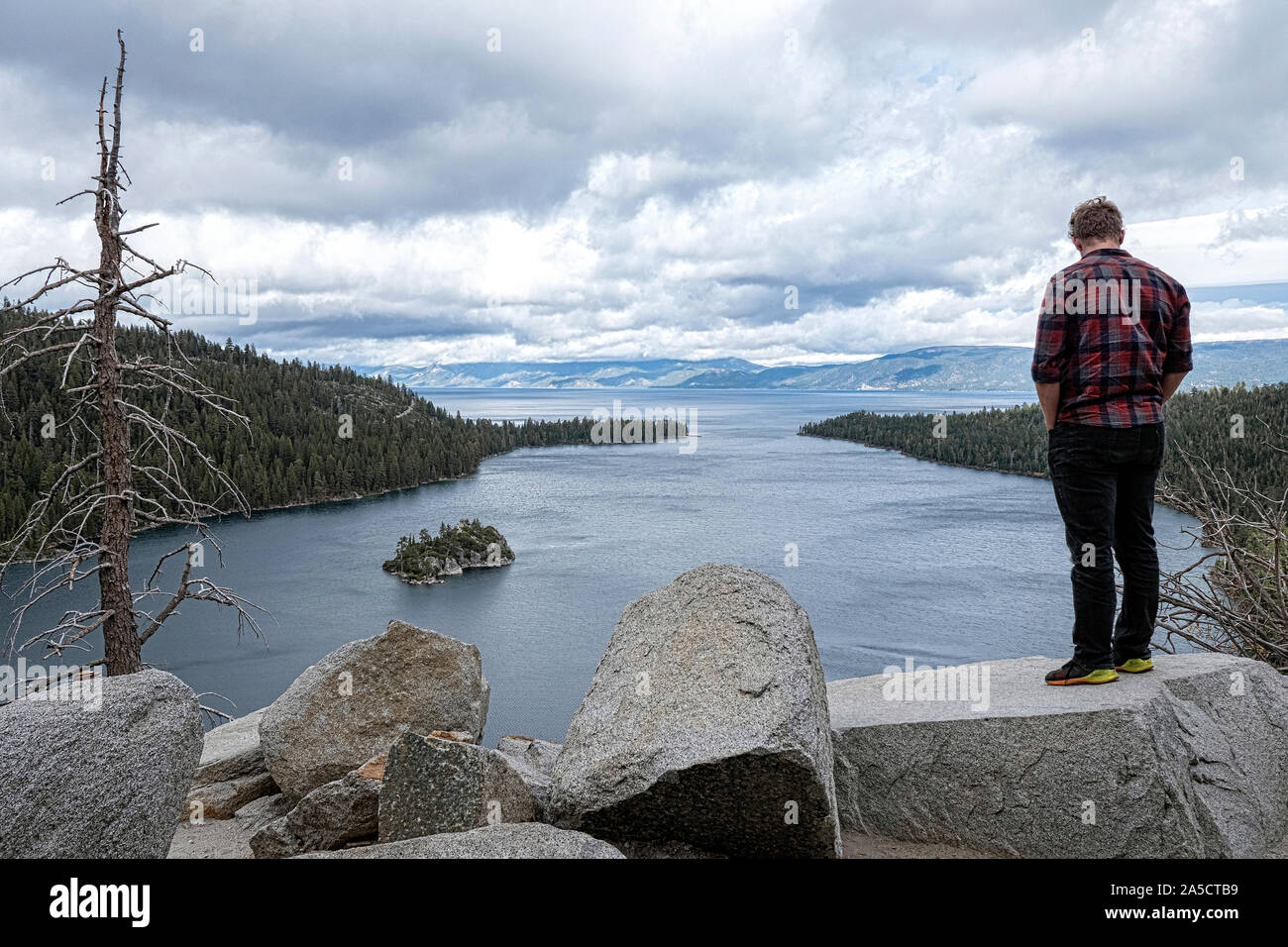 Tourist looks over Emerald Bay Lake Tahoe California USA Stock Photo