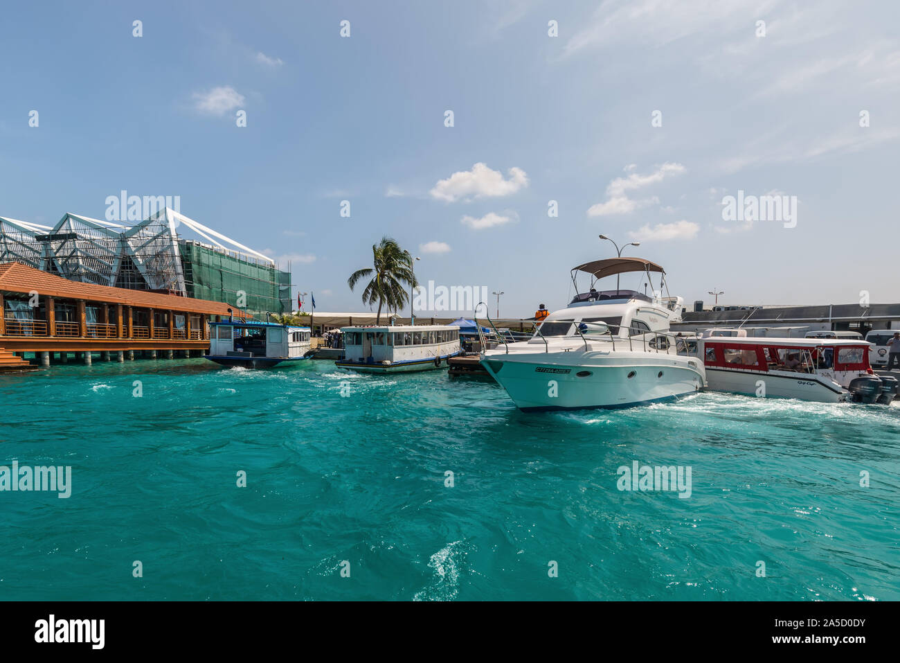 Hulhule Island, Maldives - November 18, 2017: Speed boat at the Hulhule port near Ibrahim Nasir International Airport, Maldives, Indian Ocean. Stock Photo
