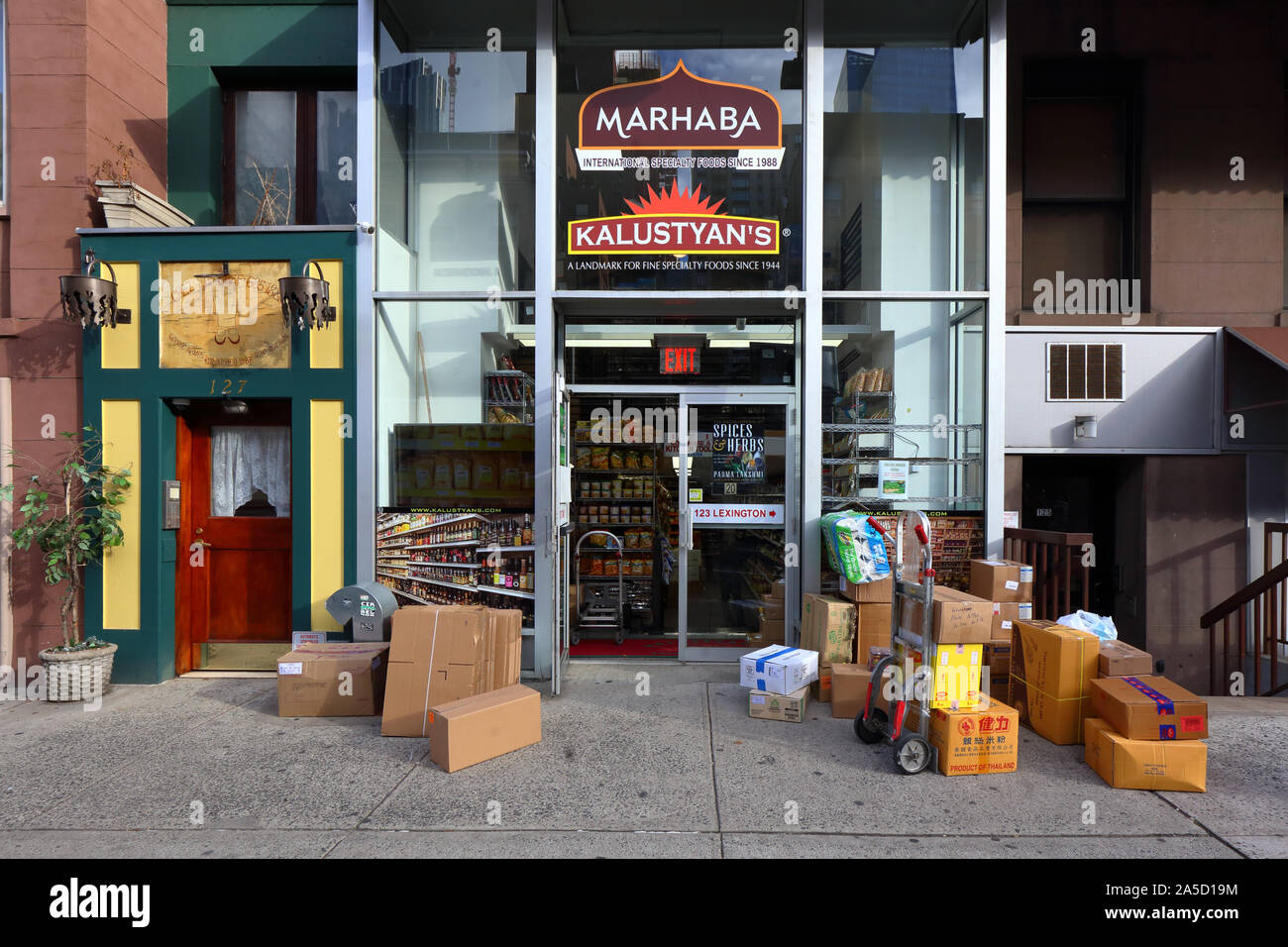 Kalustyan's retail store exit at 127 Lexington Ave, New York, NY.  exterior storefront of a specialty food market in the Curry Hill area of Manhattan. Stock Photo