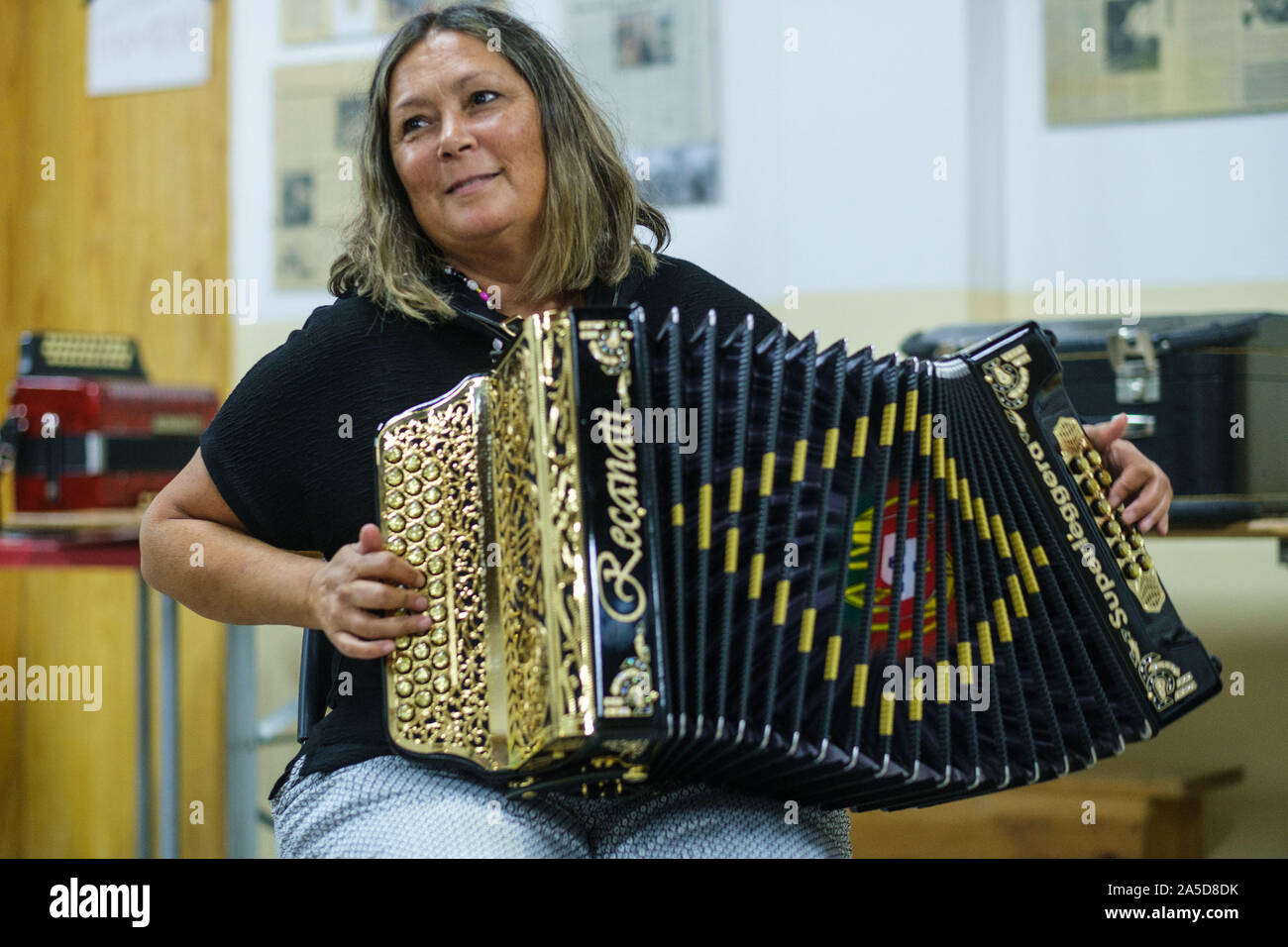 Woman playing a button accordion Stock Photo