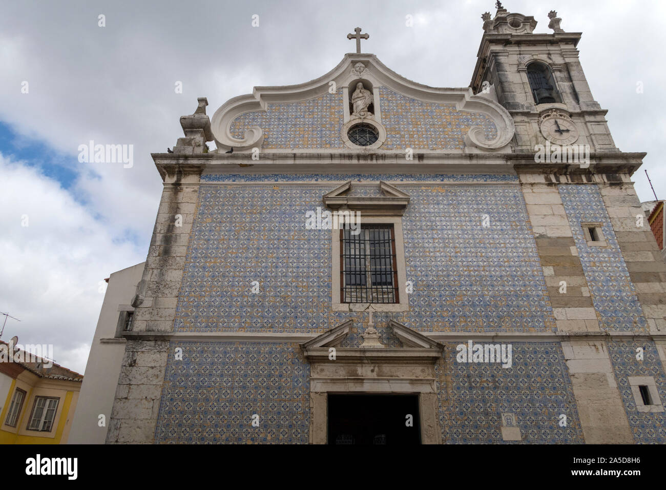 Igreja de Nossa senhora da Conceição church facade with traditional portuguese blue tiles azulejos, Seixal, Portugal, Europe Stock Photo