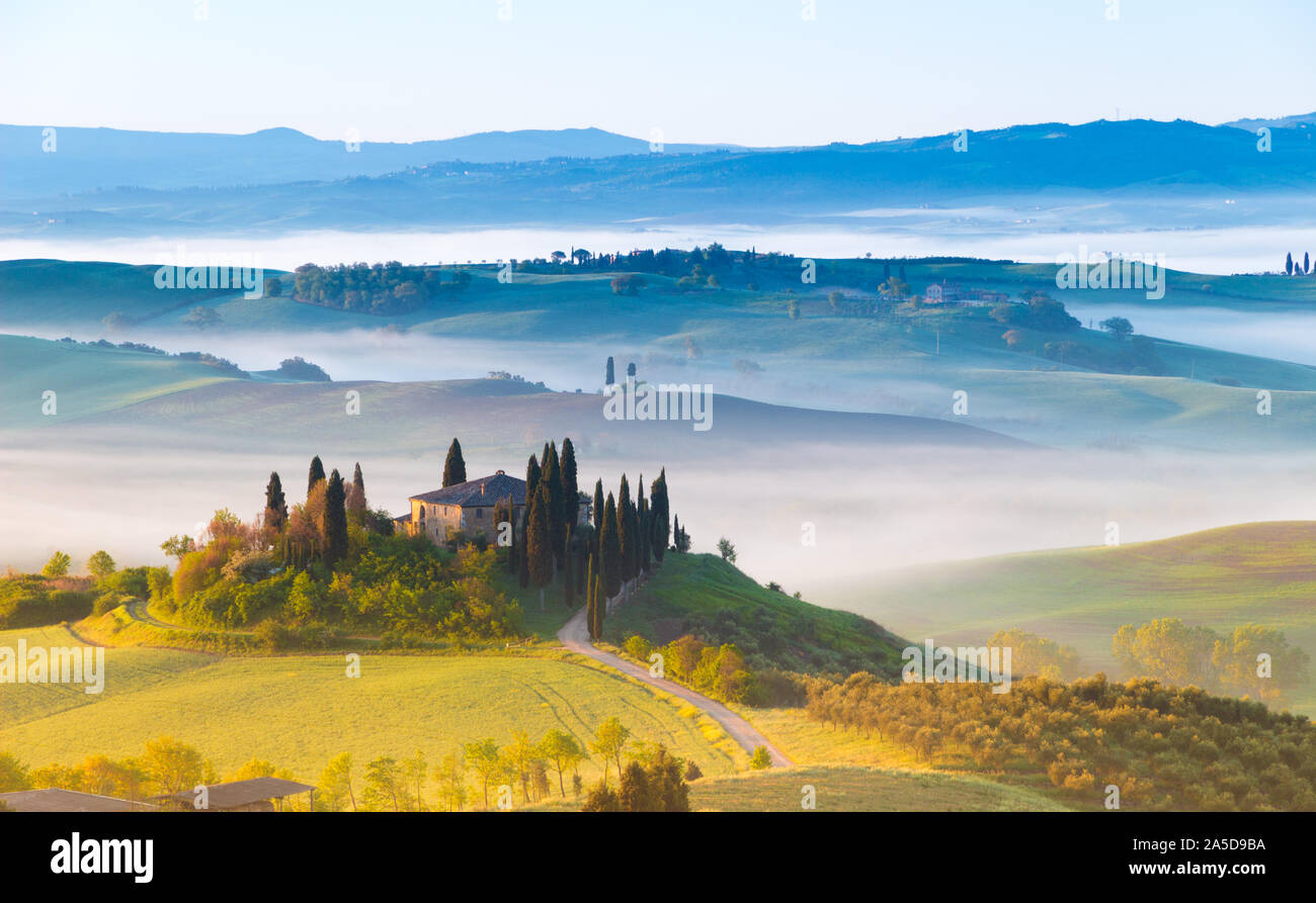 Siena, Italy - May 02, 2019: an iconic landscape in Orcia valley, Tuscany, in spring at sunrise. Stock Photo