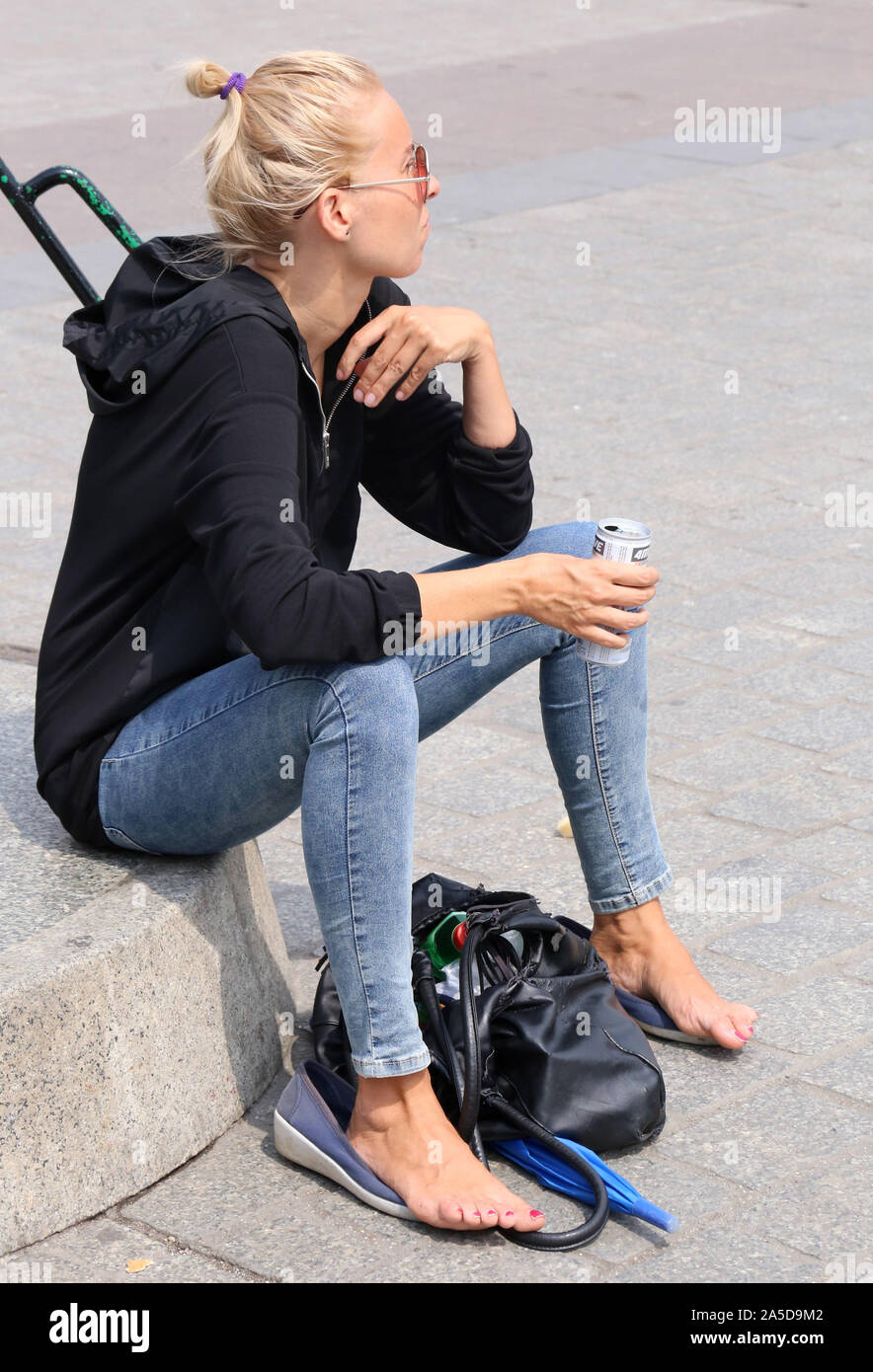 Cracow. Krakow. Poland. Tired tourist resting with her shoes off Stock  Photo - Alamy