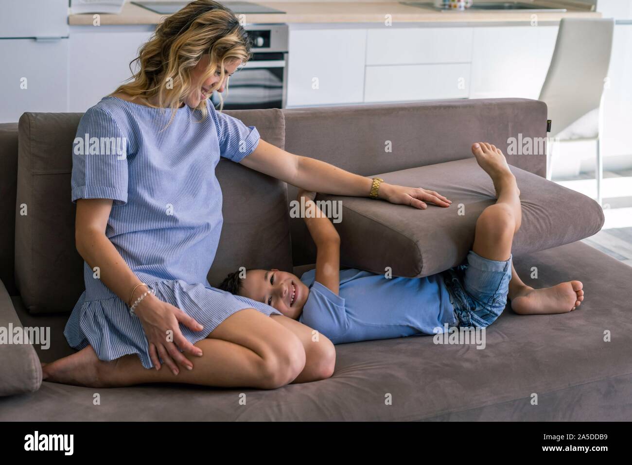 Happy mum with son at home. Stock Photo