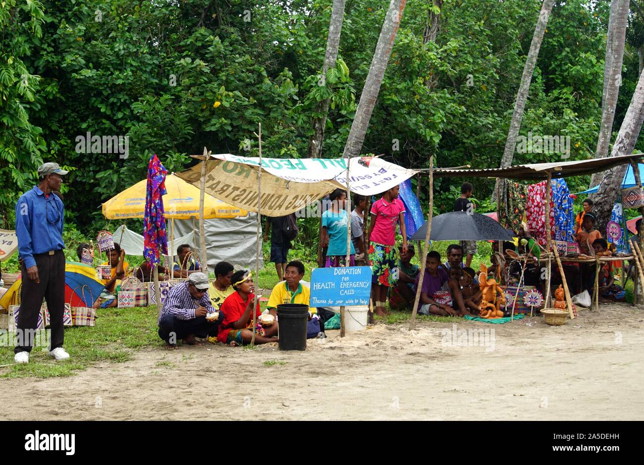 Makeshift Market Stall with Donation Buckets greeting Visitors on Arrival at Kiriwina Island Stock Photo