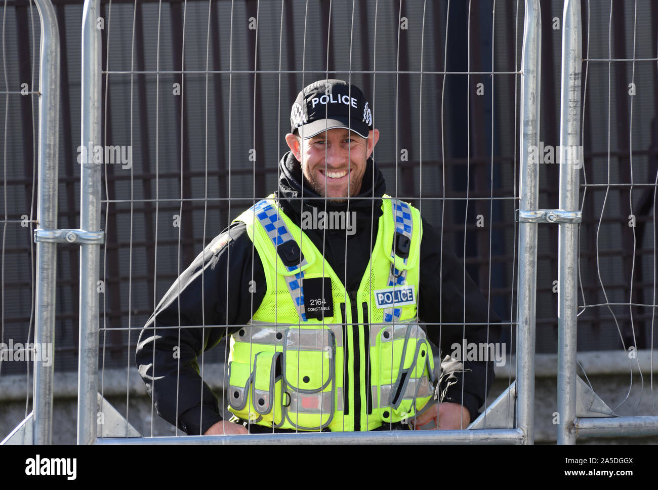 Friendly and Brave Armed Police Officer in London guarding Government Buildings Stock Photo