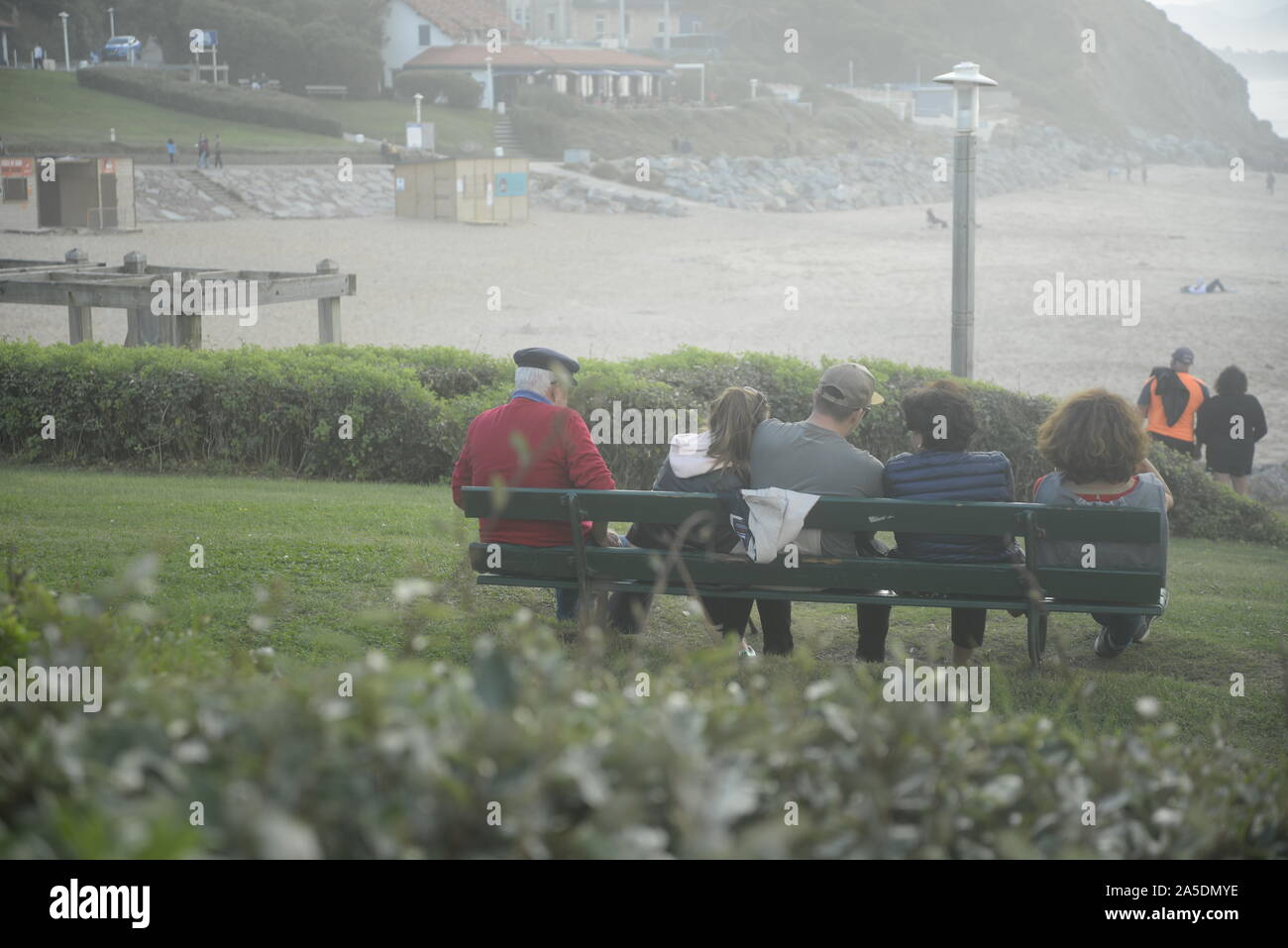 French people on a bench looking out to sea, pasakdek Stock Photo