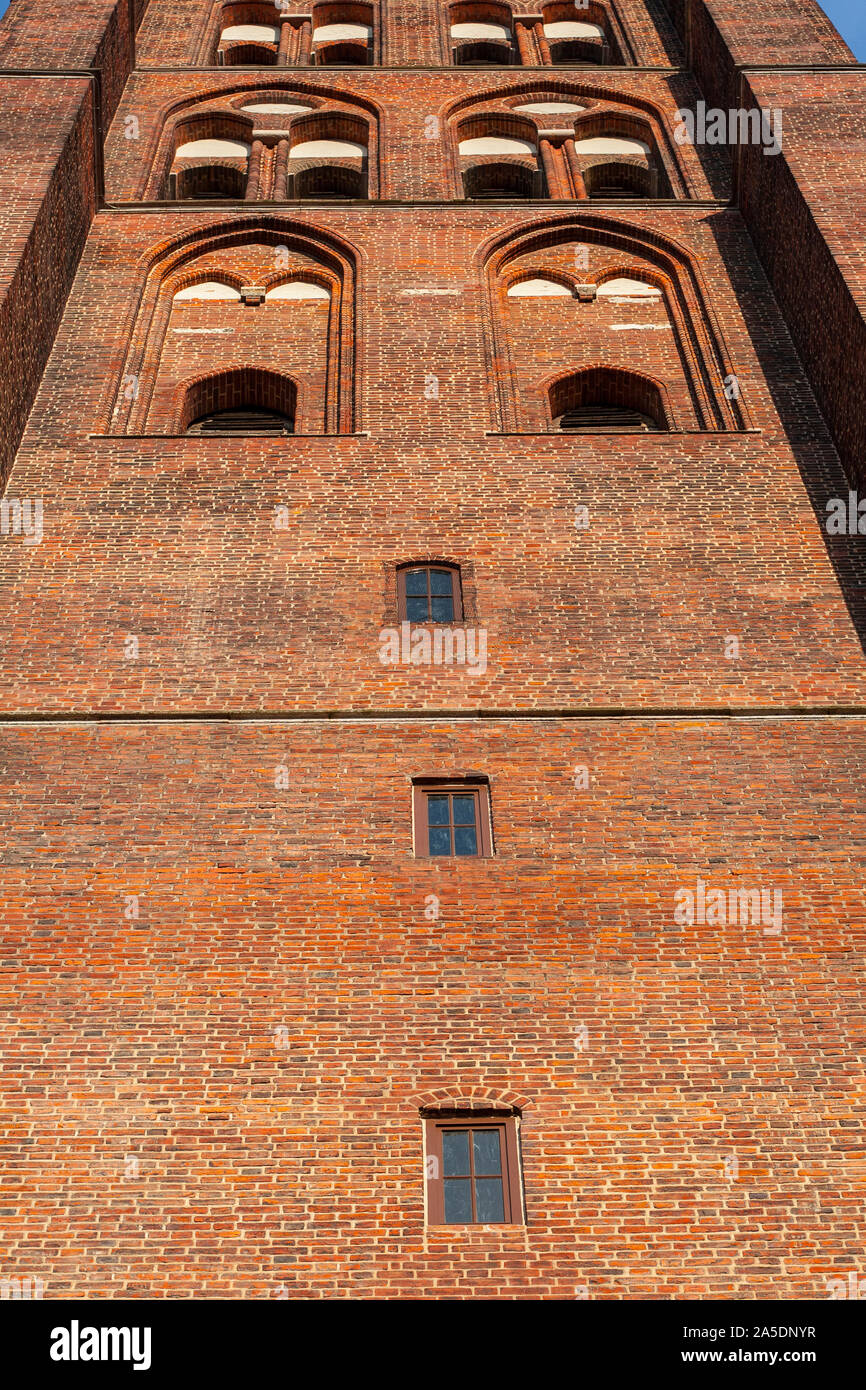 Bell Tower of gothic Basilica of the Assumption of the Blessed Virgin Mary seen from the front bottom up, Gdansk, Poland, Europe Stock Photo