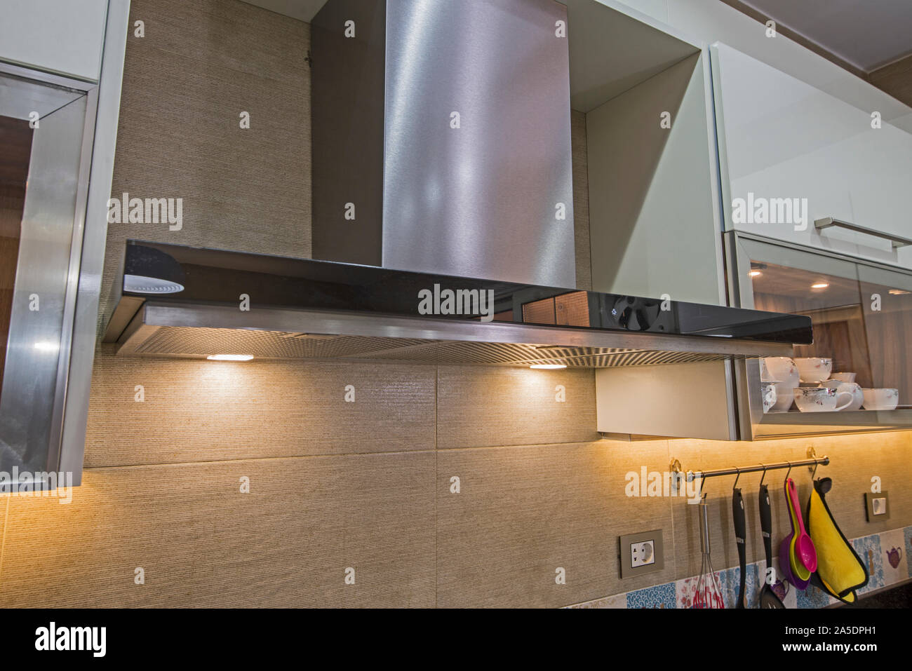 Interior design decor showing modern kitchen cooker hood appliance with extractor fan in luxury